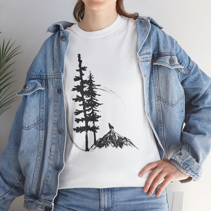 Person wearing a white t-shirt with a tree and mountain design, paired with a denim jacket.